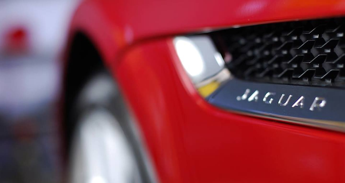 Up close shot of a red jaguar bumper