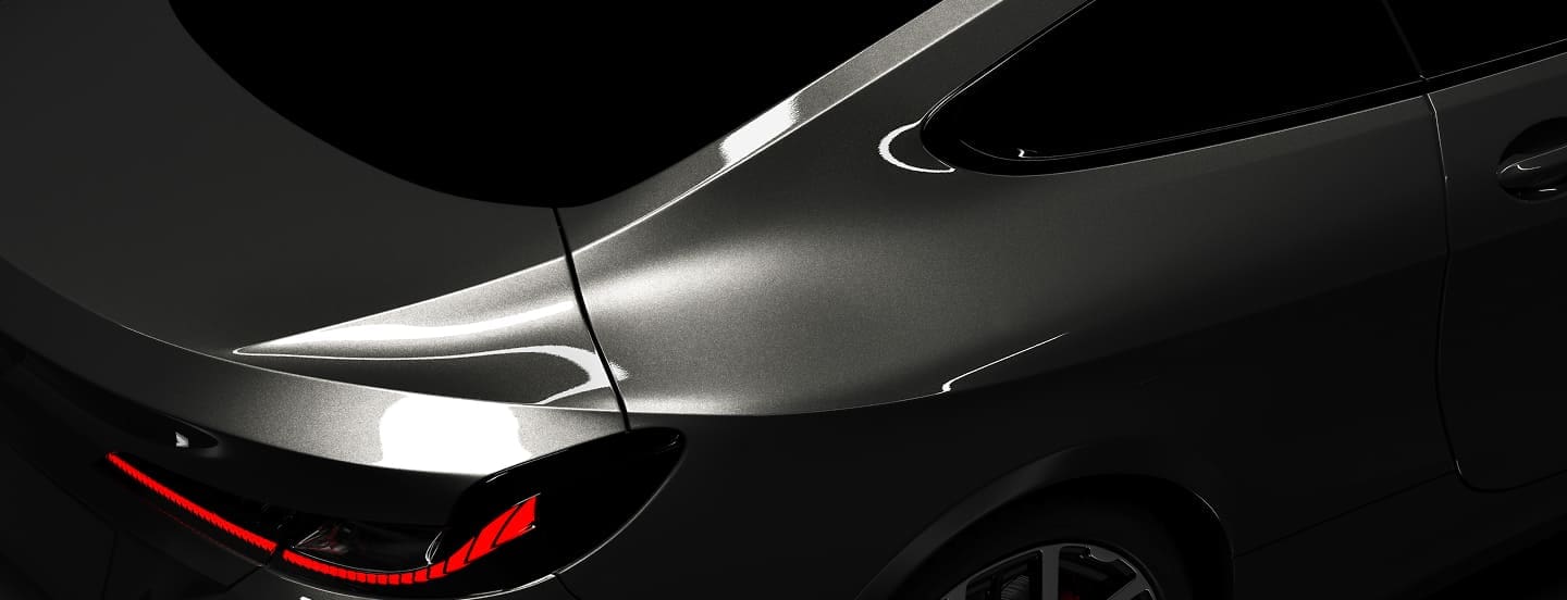 picture of a gray car taken up close to the passenger side and tail light