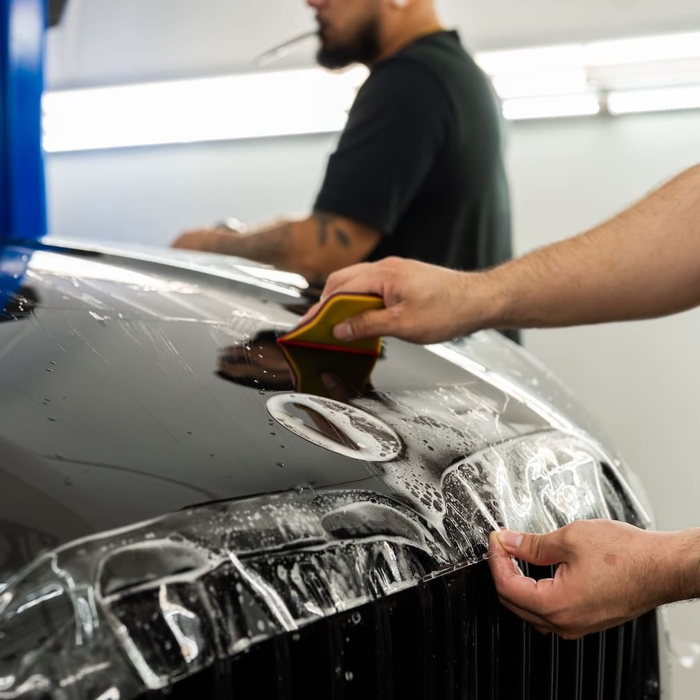 Applying PPF to the hood of a car
