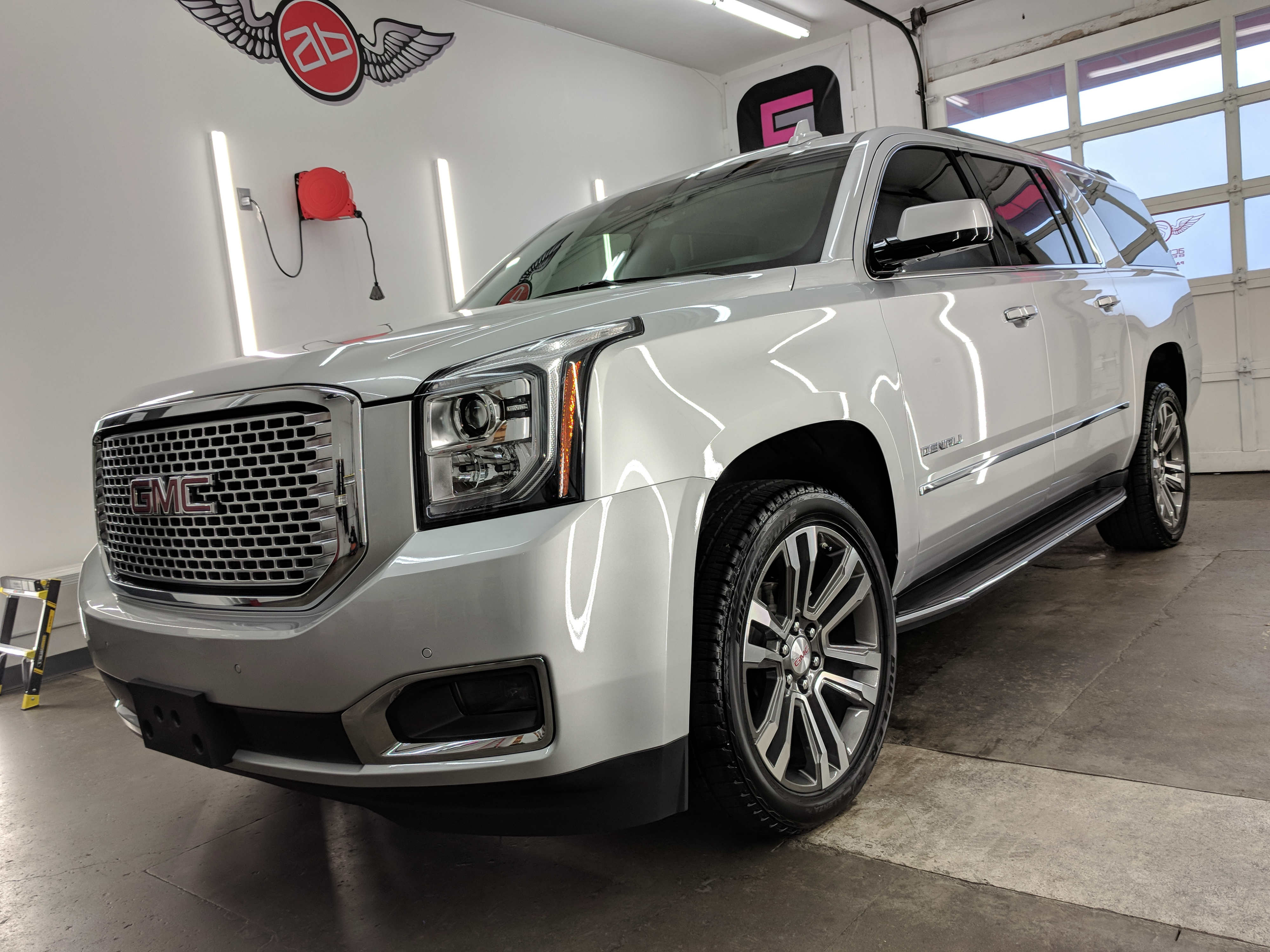 Silver GMC Denali shines after receiving ceramic coating in Accutint Bellevue service bay