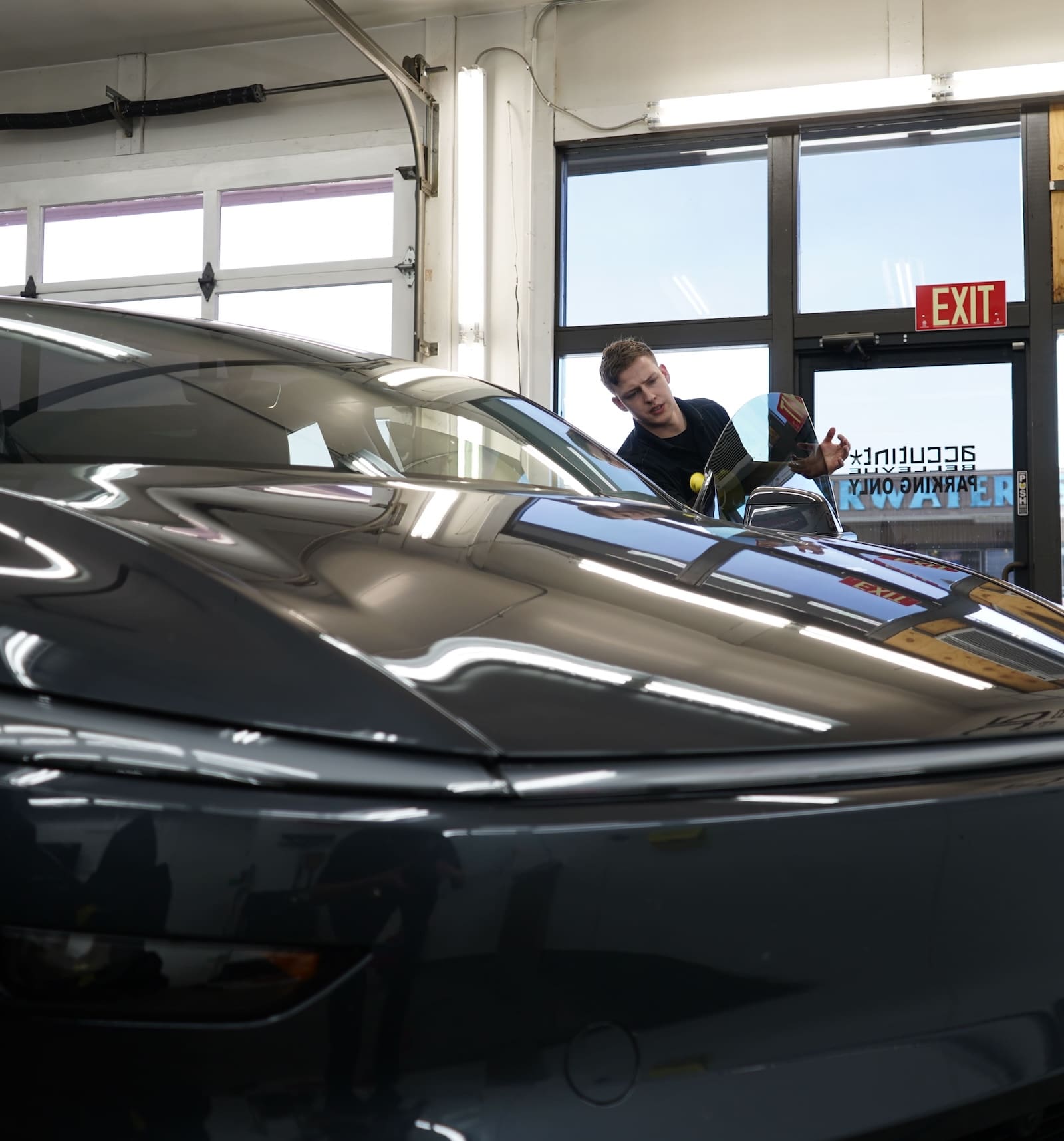 Man Working on Black Car