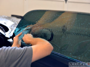 finishing up car window tinting